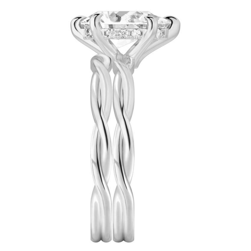 Side view of pear shape diamond twisted hidden halo engagement ring set white gold