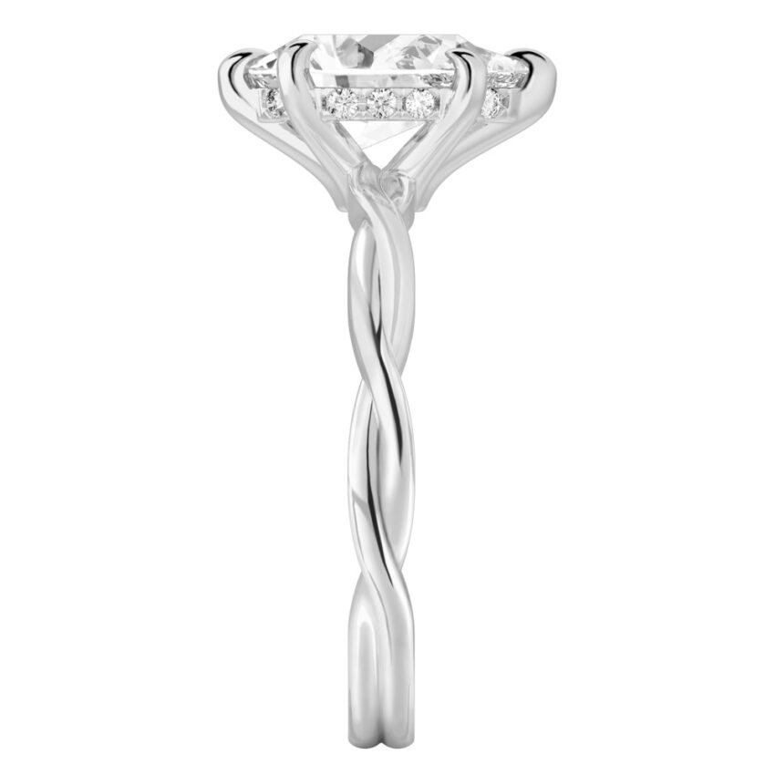 Side view of pear shape diamond twisted hidden halo engagement ring in white gold