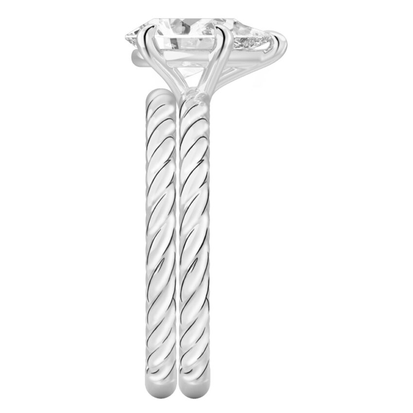 Side view of pear shape diamond twisted rope engagement ring set platinum