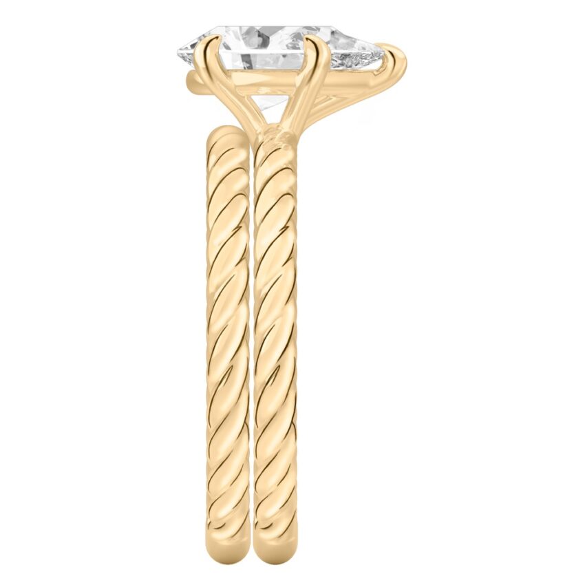 Side view of pear shape diamond twisted rope engagement ring set yellow gold