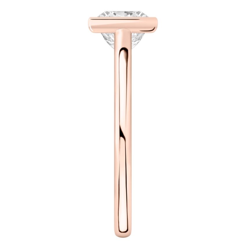 Side view of princess cut diamond bezel engagement ring in rose gold
