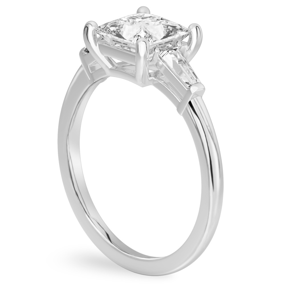 Angle view of princess cut diamond tapered baguette engagement ring in palladium