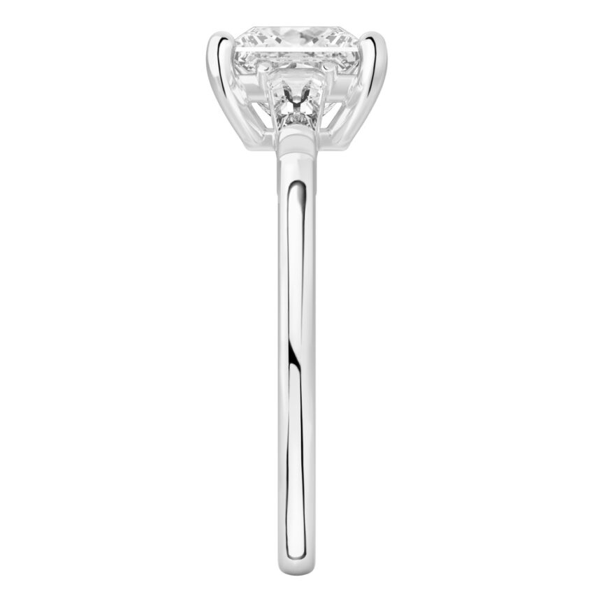 Side view of princess cut diamond tapered baguette engagement ring in white gold