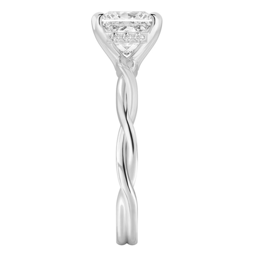 Side view of princess cut diamond twisted hidden halo engagement ring in platinum