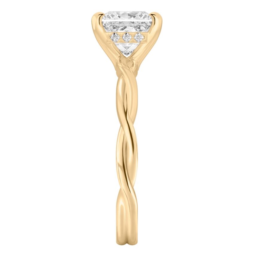 Side view of princess cut diamond twisted hidden halo engagement ring in yellow gold
