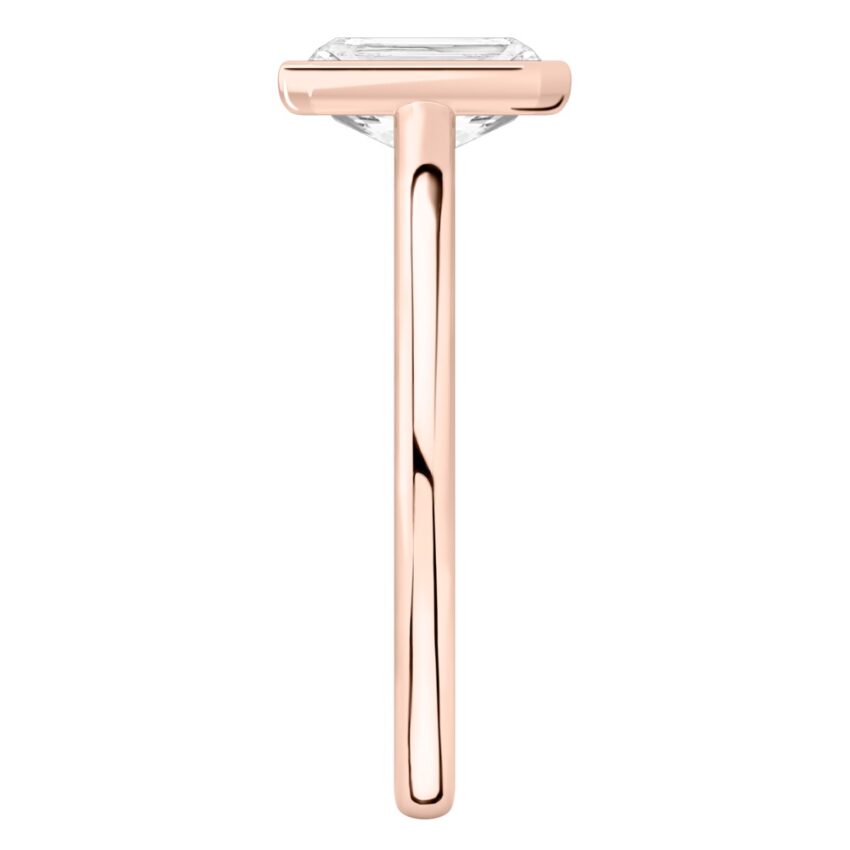 Side view of radiant cut diamond bezel engagement ring in rose gold
