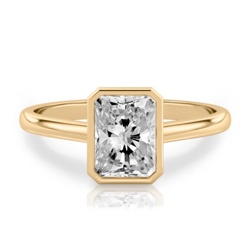 radiant cut diamond bezel engagement ring in yellow gold