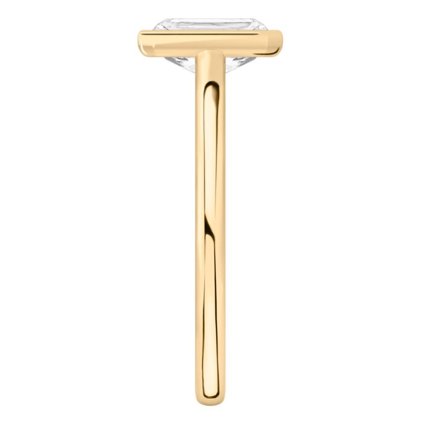 Side view of radiant cut diamond bezel engagement ring in yellow gold