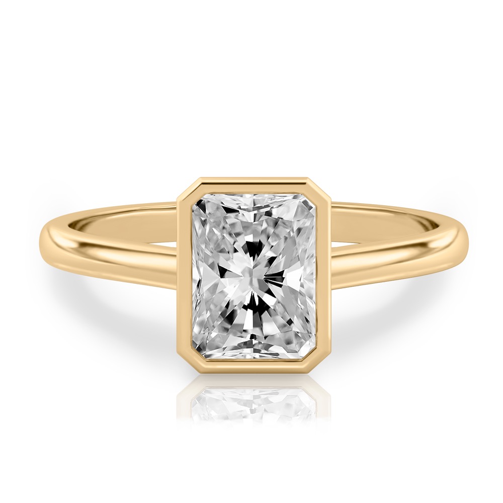 radiant cut diamond bezel engagement ring in yellow gold