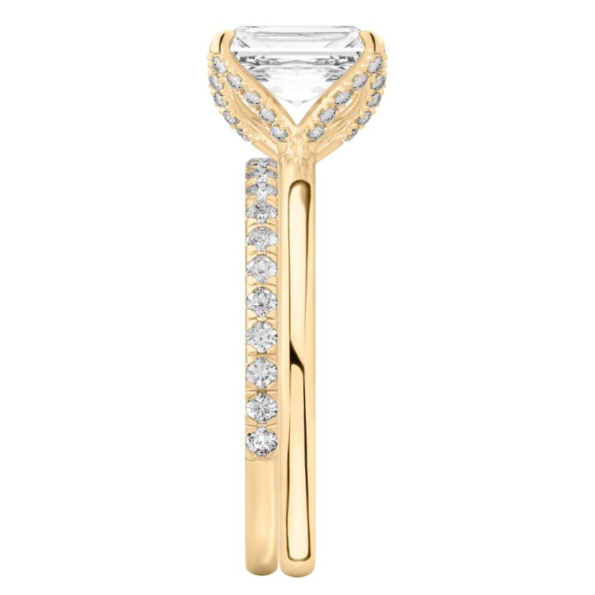 Side view of radiant cut diamond pave petal prong engagement ring set yellow gold