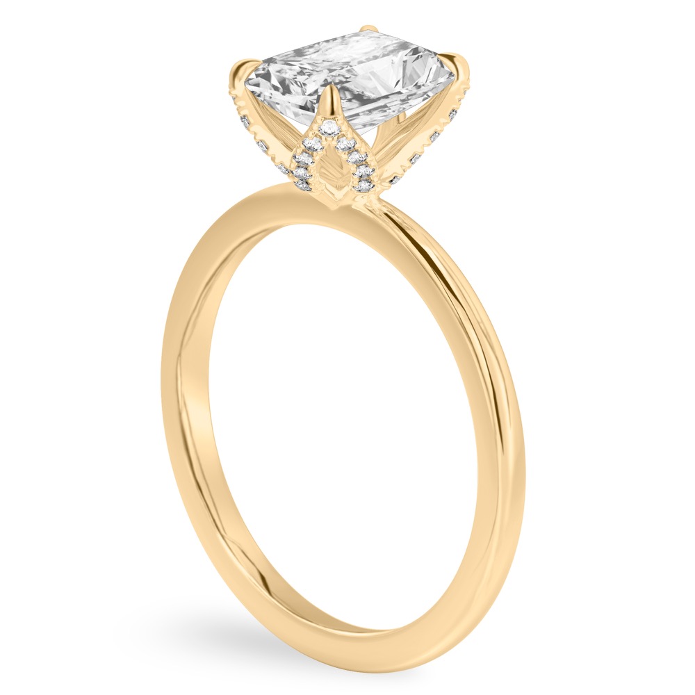 Angle view of radiant cut diamond pave petal prong engagement ring in yellow gold
