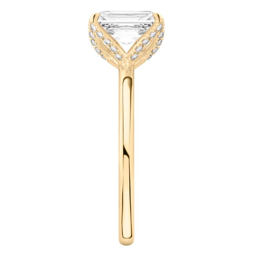 Side view of radiant cut diamond pave petal prong engagement ring in yellow gold