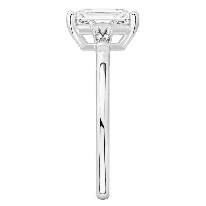 Side view of radiant cut diamond tapered baguette engagement ring in palladium