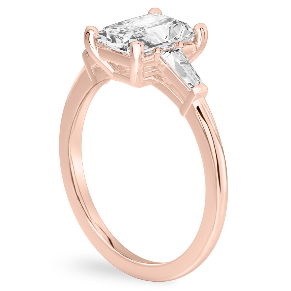 Angle view of radiant cut diamond tapered baguette engagement ring in rose gold