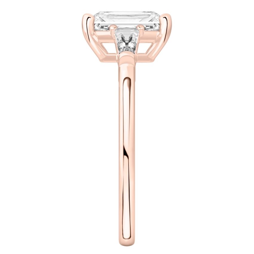 Side view of radiant cut diamond tapered baguette engagement ring in rose gold