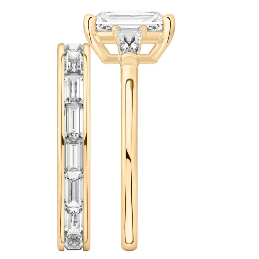 Side view of radiant cut diamond tapered baguette engagement ring set yellow gold