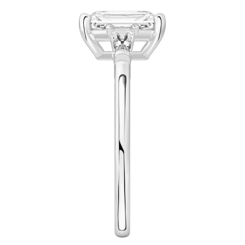 Side view of radiant cut diamond tapered baguette engagement ring in white gold