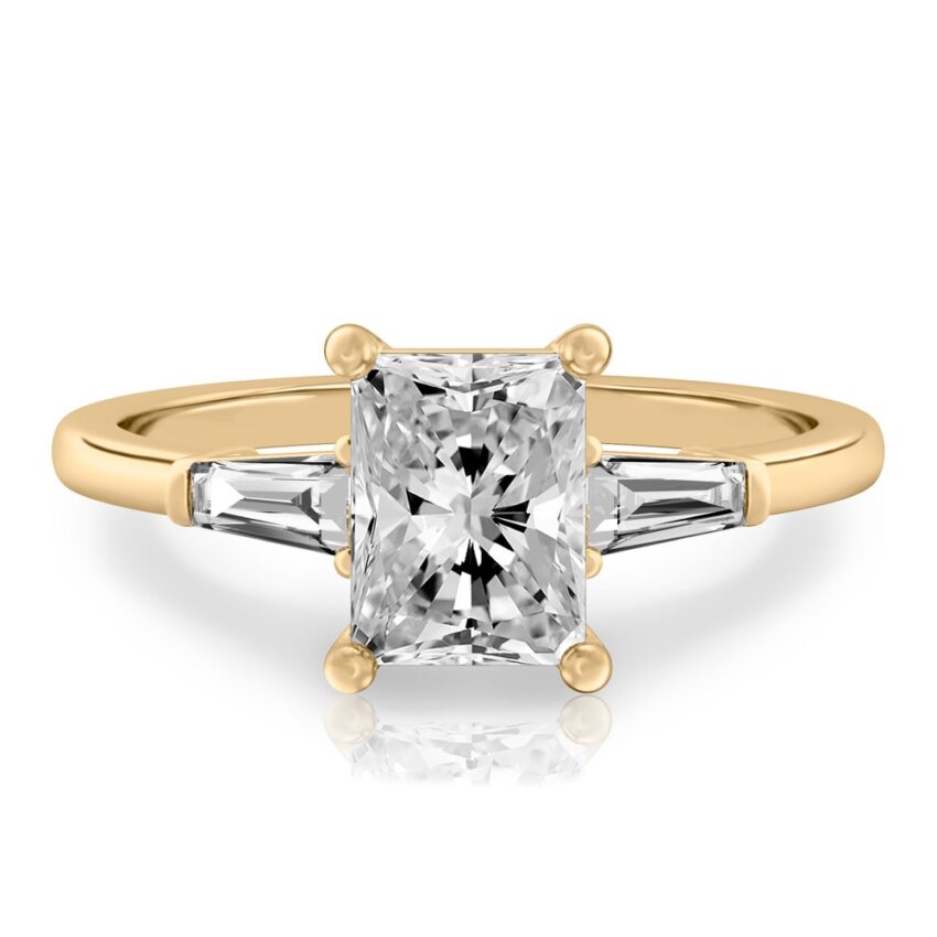 radiant cut diamond tapered baguette engagement ring in yellow gold