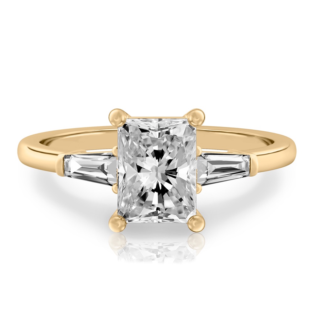 radiant cut diamond tapered baguette engagement ring in yellow gold