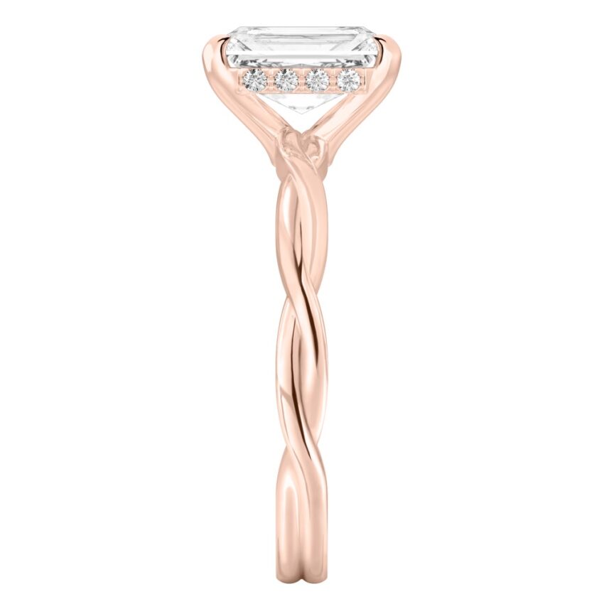 Side view of radiant cut diamond twisted hidden halo engagement ring in rose gold