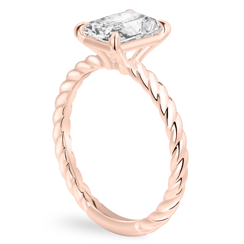 Angle view of radiant cut diamond twisted rope engagement ring in rose gold