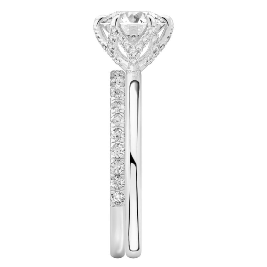 Side view of round cut diamond pave petal prong engagement ring set white gold