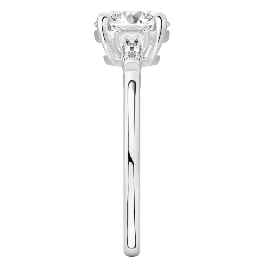 Side view of round cut diamond tapered baguette engagement ring in palladium