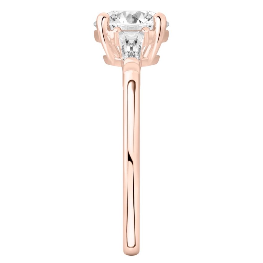 Side view of round cut diamond tapered baguette engagement ring in rose gold