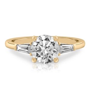 round cut diamond tapered baguette engagement ring in yellow gold