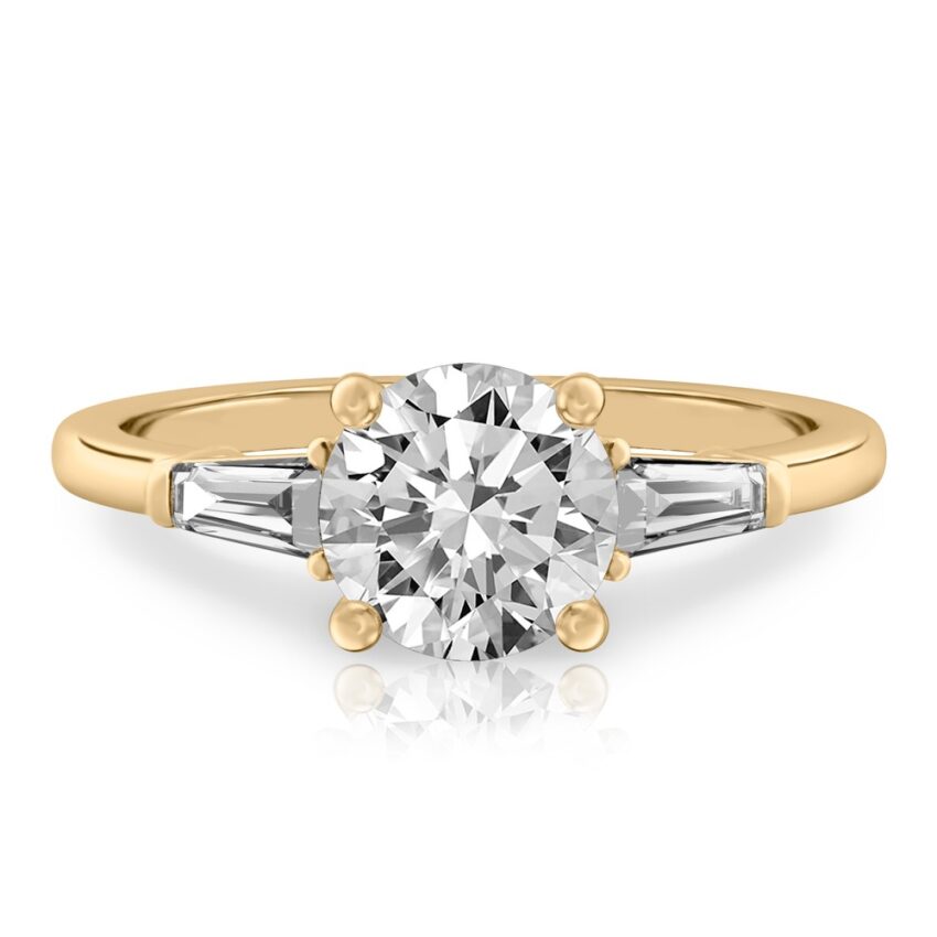 round cut diamond tapered baguette engagement ring in yellow gold