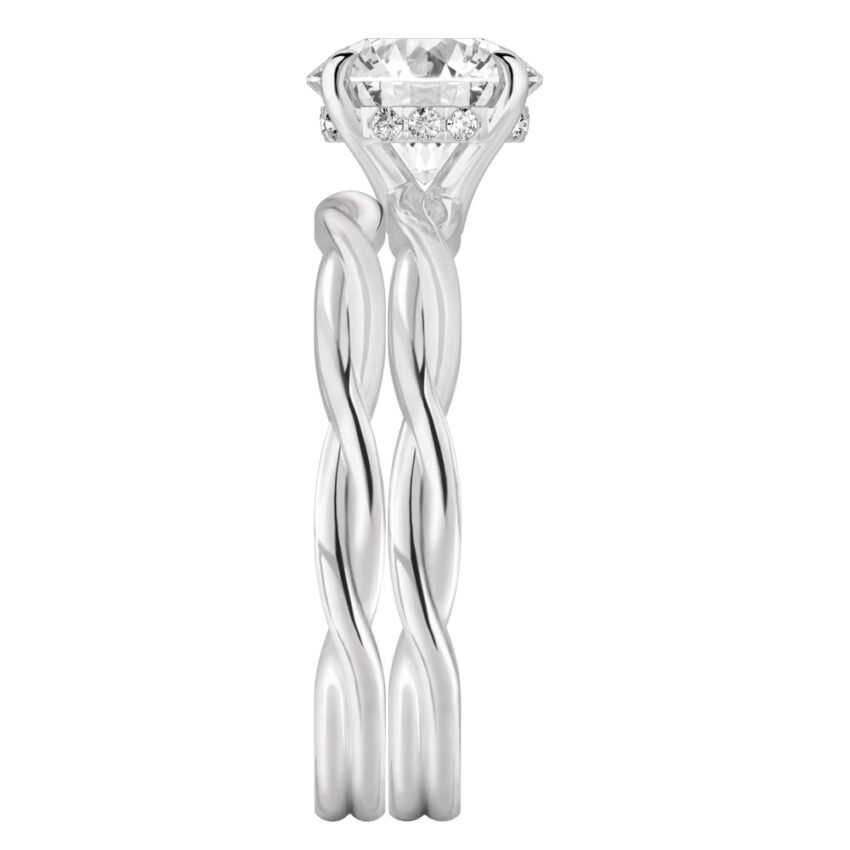 Side view of round cut diamond twisted hidden halo engagement ring set platinum