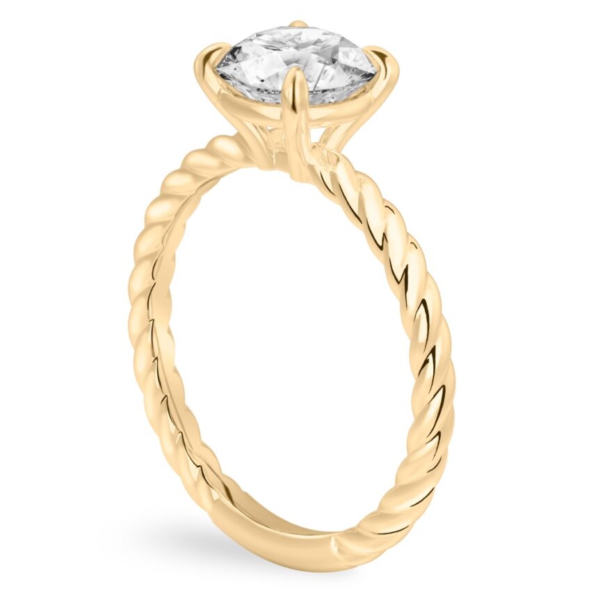 Angle view of round cut diamond twisted rope engagement ring in yellow gold