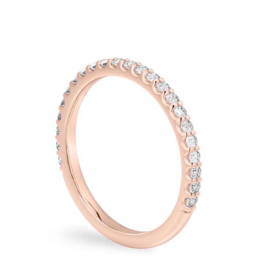 Angle view of shared prong wedding band in rose gold