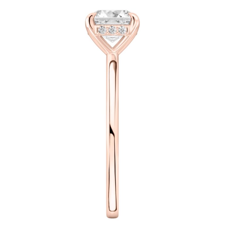 Side view of asscher cut diamond hidden halo engagement ring in rose gold