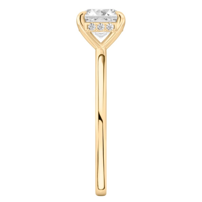Side view of asscher cut diamond hidden halo engagement ring in yellow gold