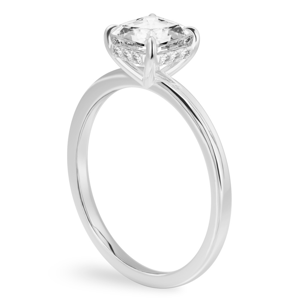 Angle view of asscher cut diamond ultra low hidden halo engagement ring in white gold