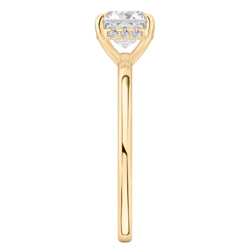 Side view of asscher cut diamond ultra low hidden halo engagement ring in yellow gold