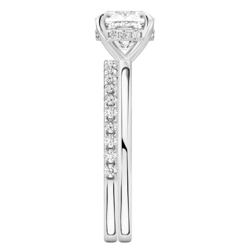 Side view of cushion cut diamond hidden halo engagement ring set platinum