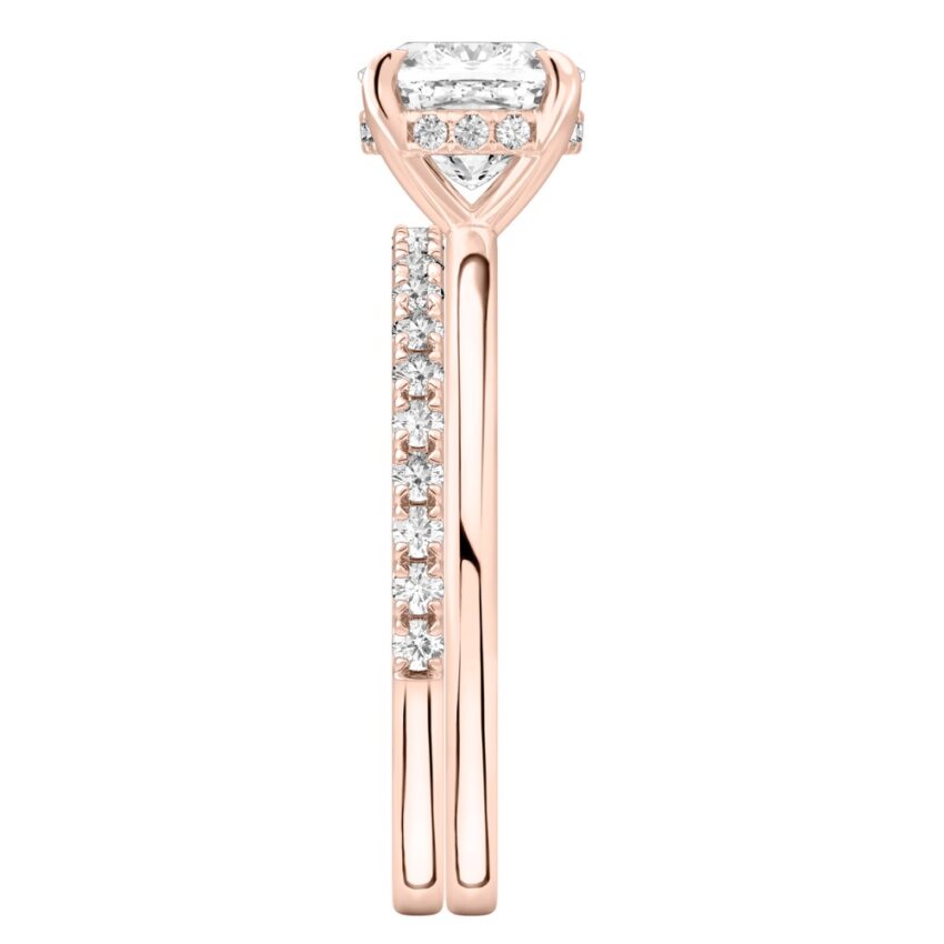 Side view of cushion cut diamond hidden halo engagement ring set rose gold