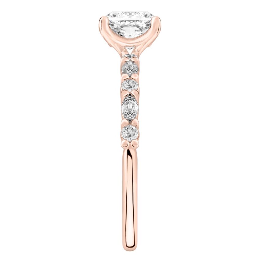 Side view of cushion cut diamond marquise and round diamond ring rose gold