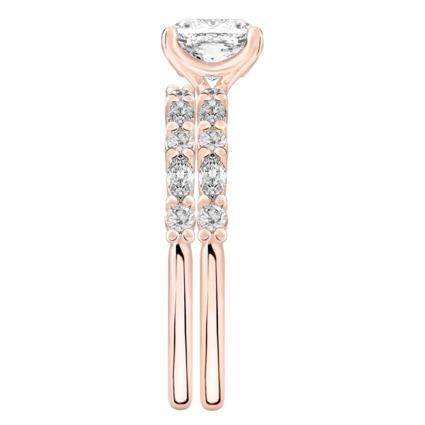 Side view of cushion cut diamond marquise and round diamond ring set rose gold