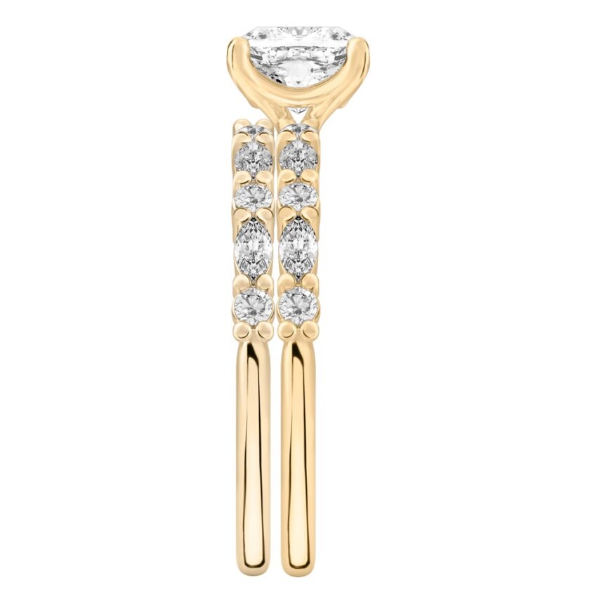 Side view of cushion cut diamond marquise and round diamond ring set yellow gold