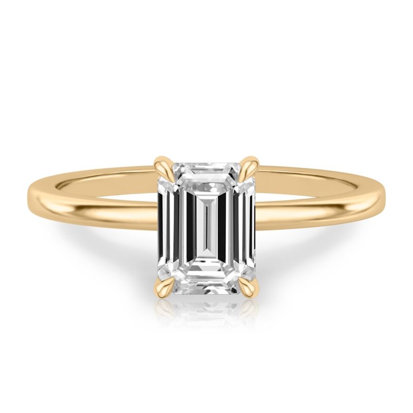 emerald cut diamond hidden halo engagement ring in yellow gold