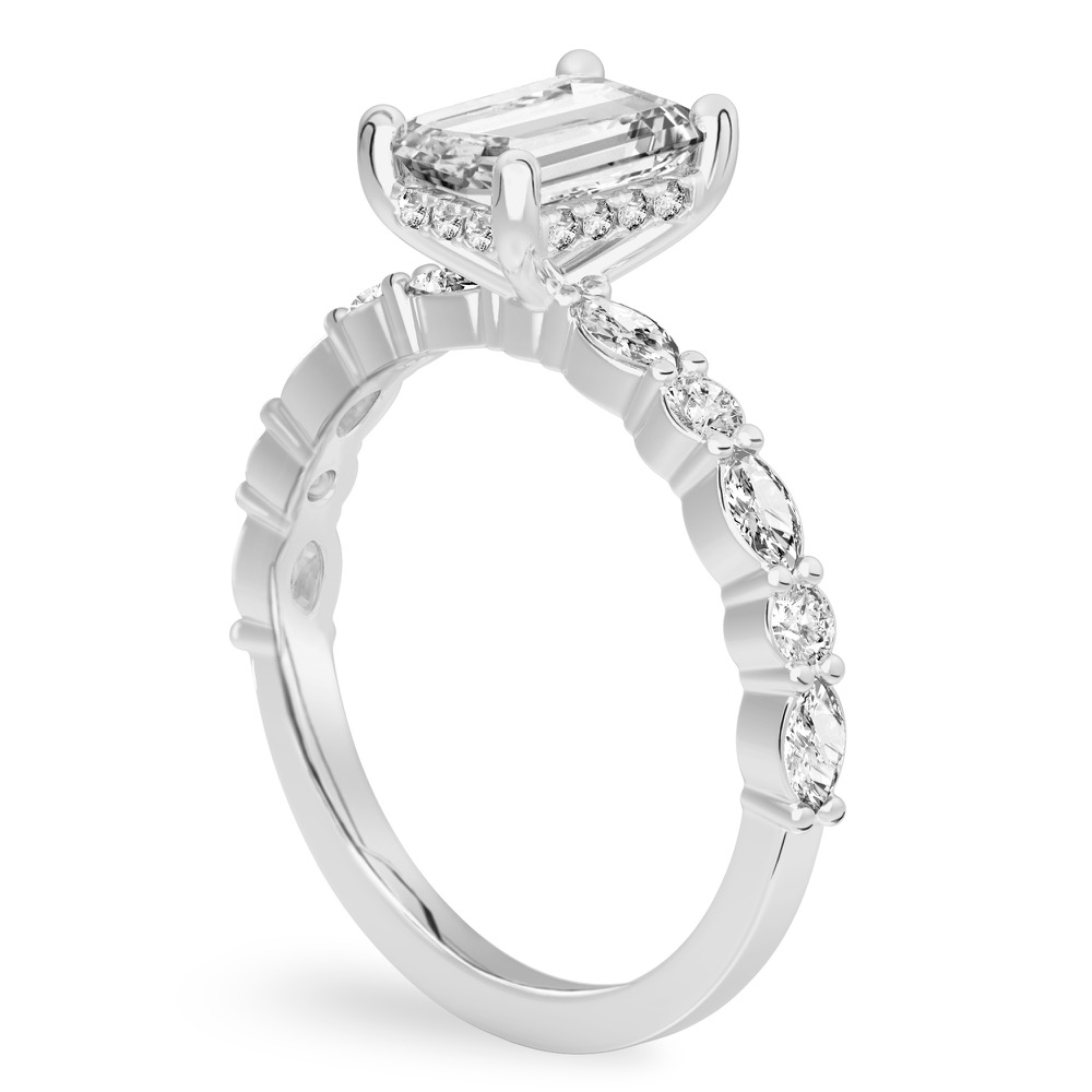 Angle view of emerald cut diamond hidden halo marquise and round diamond ring white gold