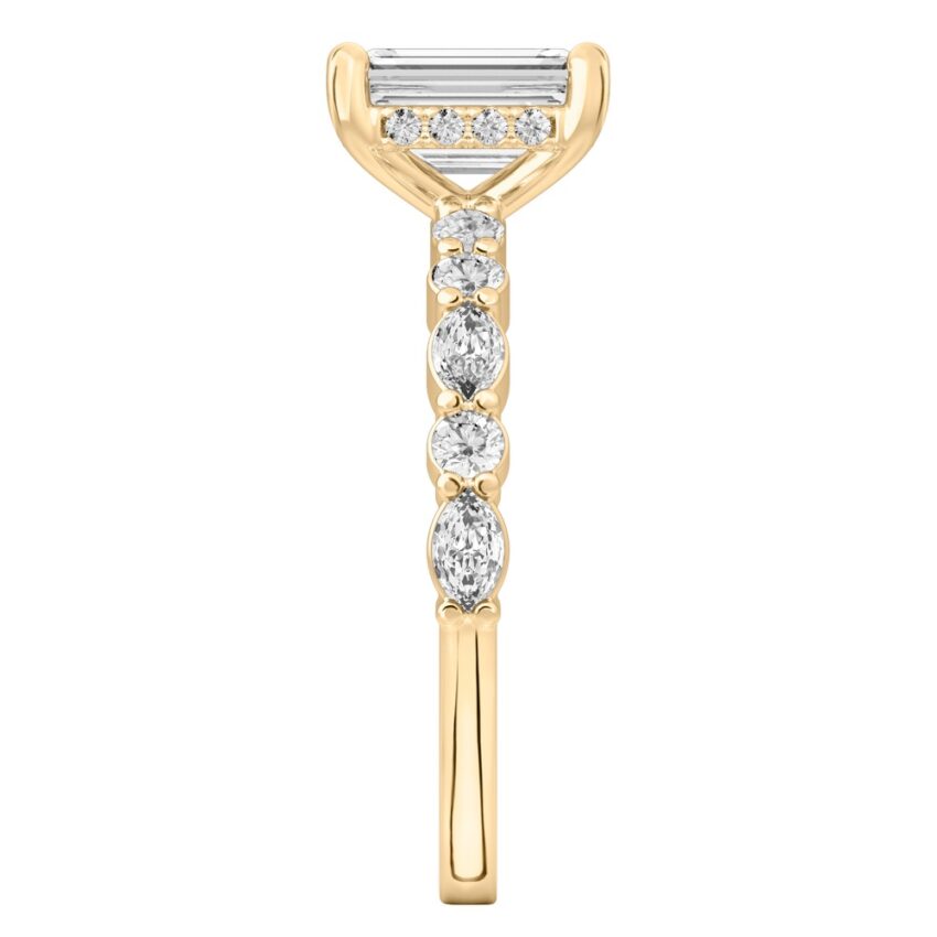 Side view of emerald cut diamond hidden halo marquise and round diamond ring yellow gold