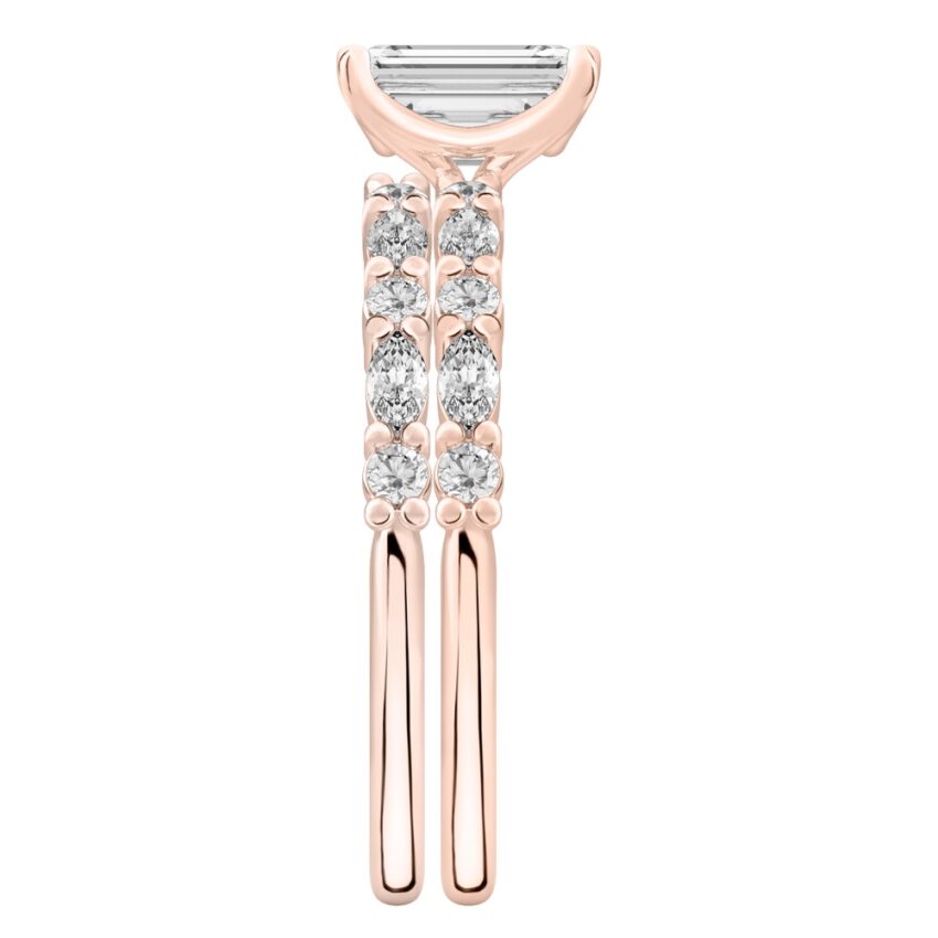 Side view of emerald cut diamond marquise and round diamond ring set rose gold