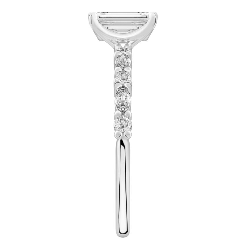 Side view of emerald cut diamond marquise and round diamond ring white gold