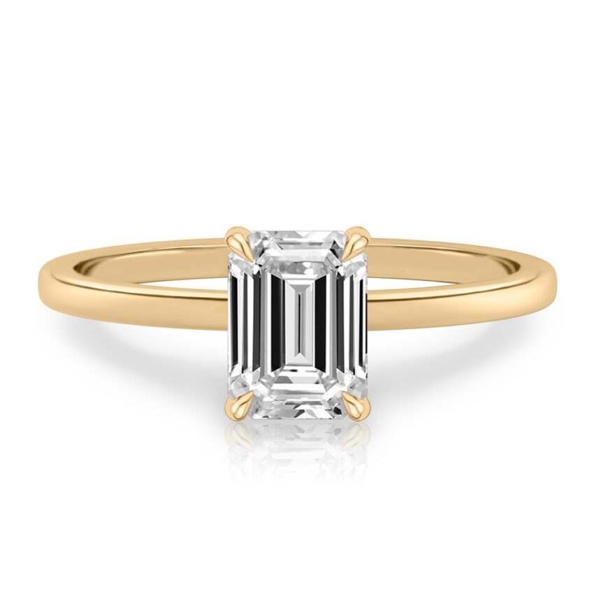 emerald cut diamond ultra low hidden halo engagement ring in yellow gold