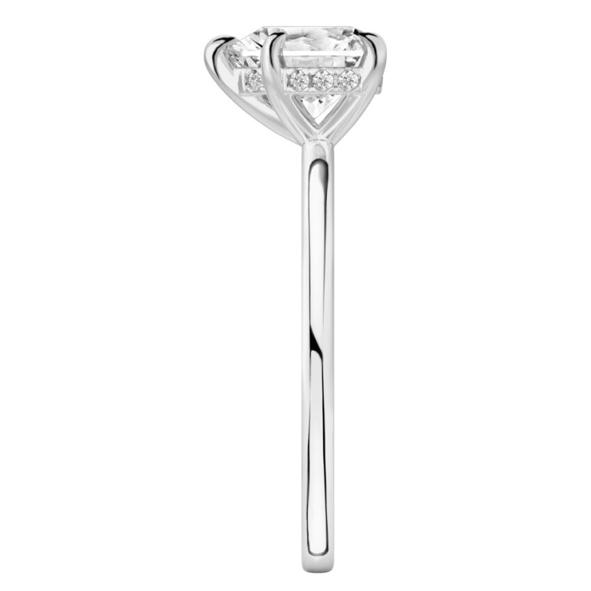 Side view of heart shape diamond hidden halo engagement ring in platinum