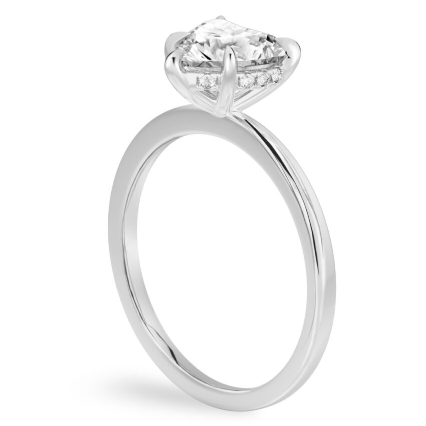 Angle view of heart shape diamond hidden halo engagement ring in white gold